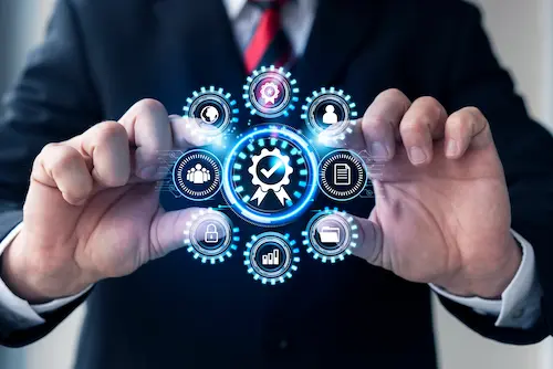 Business professional holding a holographic display of connected service icons